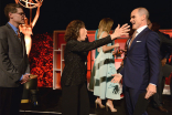 Television Academy governor Lily Tomlin greets Michael Kelly as Television Academy governor Bob Bergen looks on at the Performers Nominee Reception, September 16, 2016 at the Pacific Design Center, West Hollywood, California.