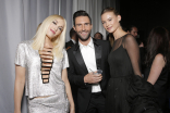 Gwen Stefani (l), Adam Levine (c), and Behati Prinsloo (r) at the 66th Emmy Awards.